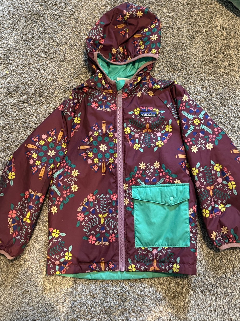 Patagonia Girls' Burgundy Floral Hooded Raincoat with Teal Pocket